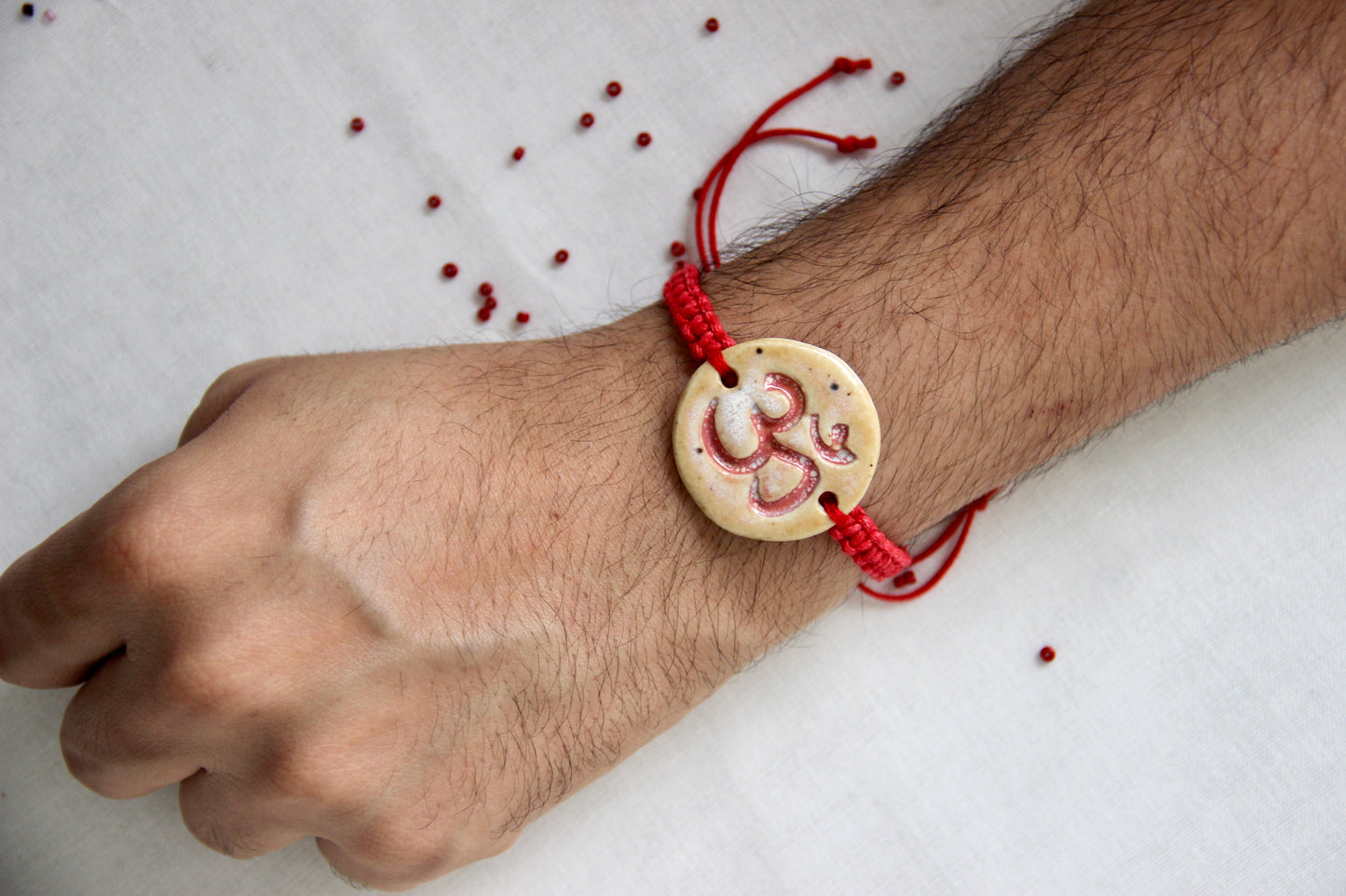 Om Charm Single Rakhi | Sacred Red