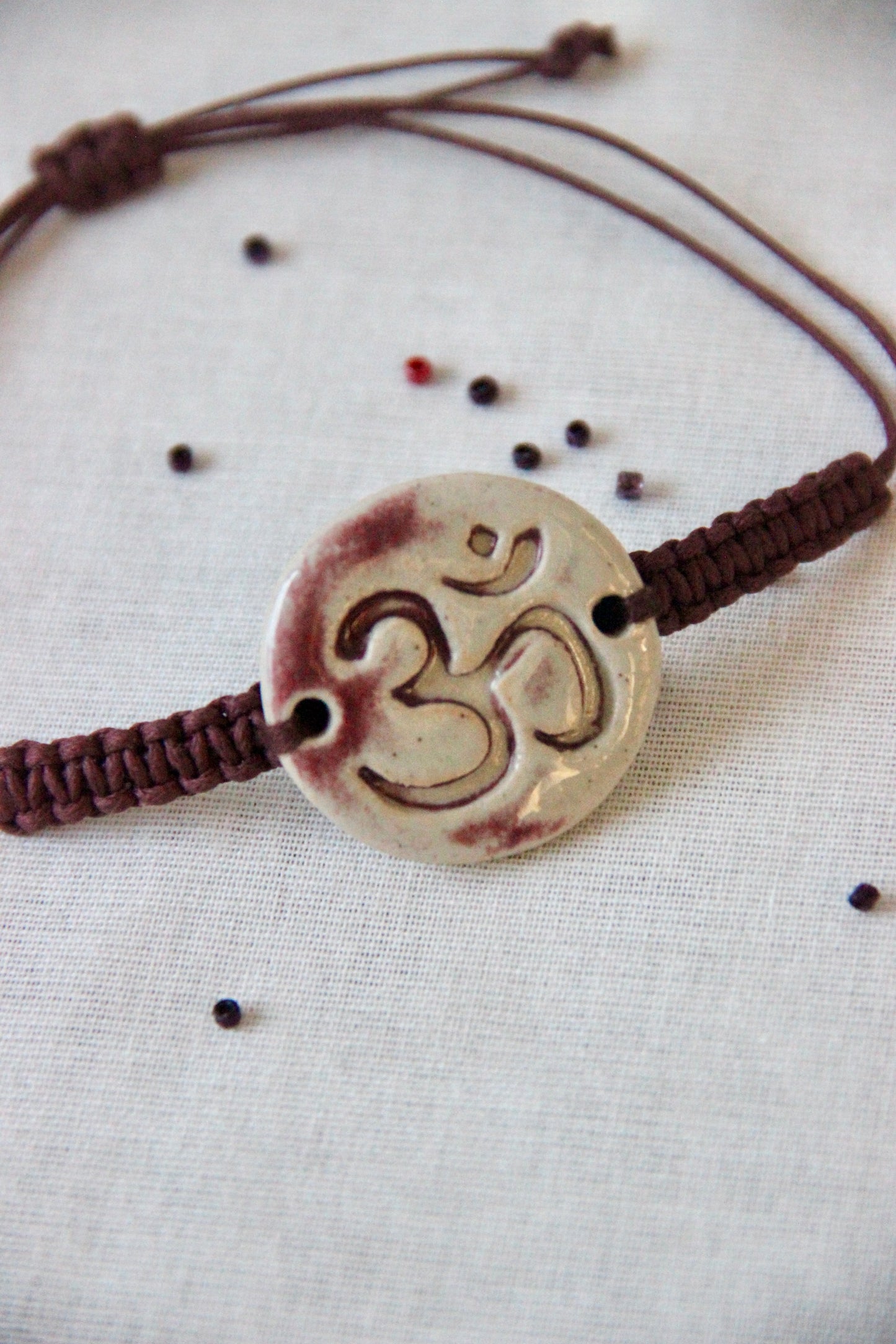 Om Charm Single Rakhi | Brown
